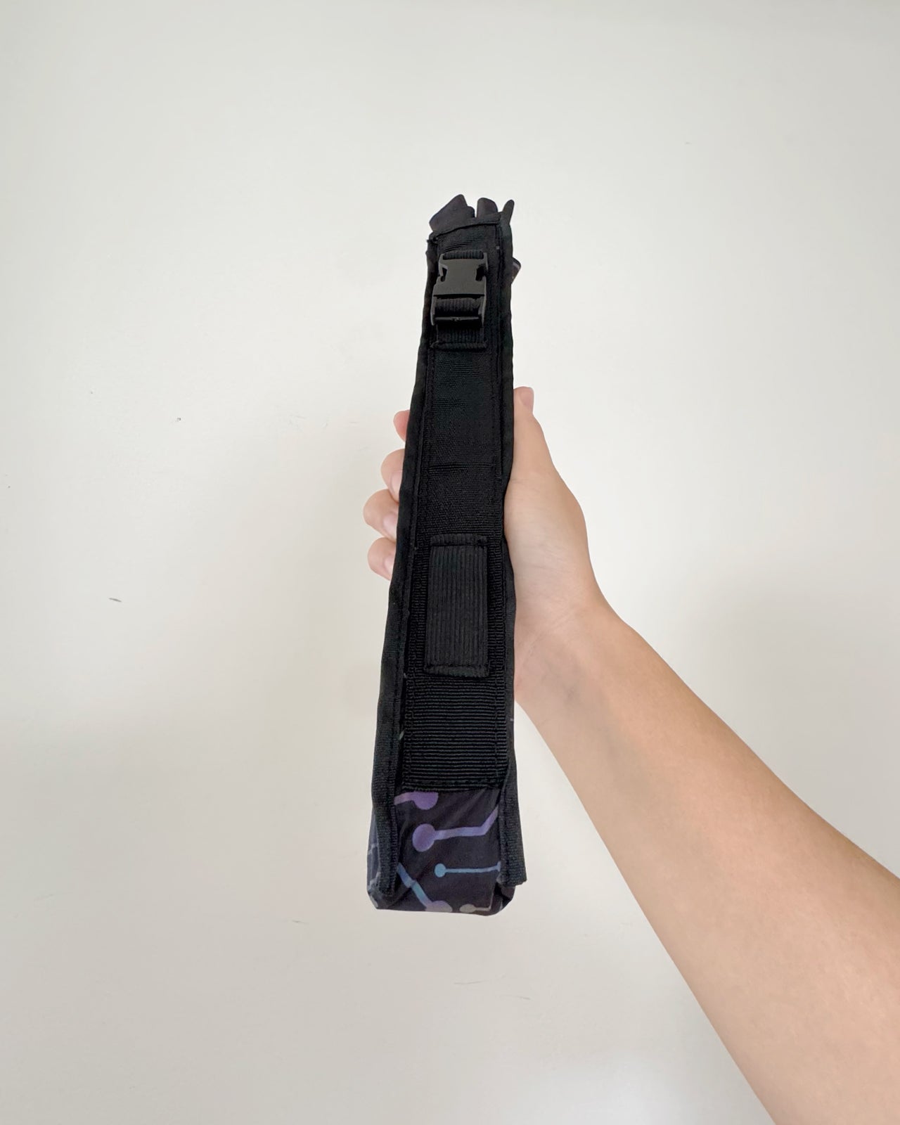 Fan holster attached to bag strap for hands-free convenience