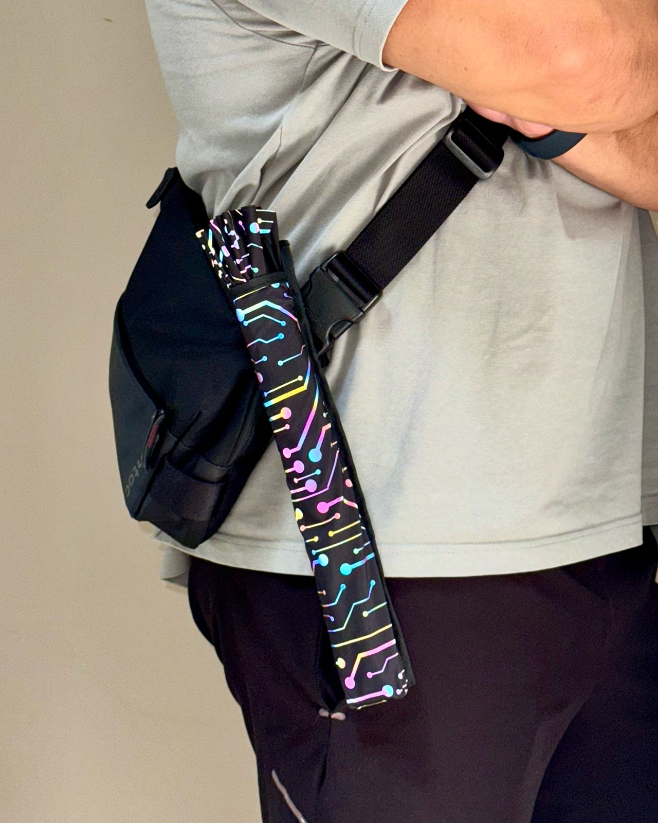 Fan holster attached to bag strap for hands-free convenience