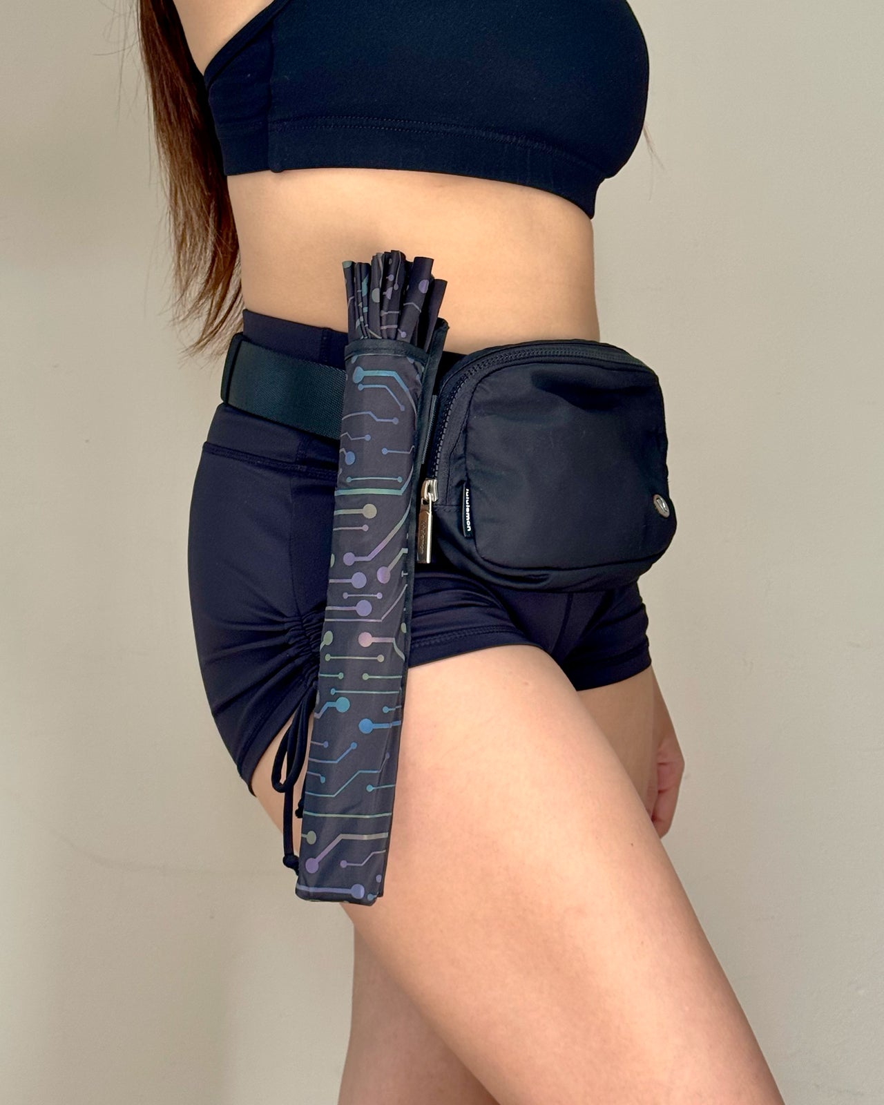Electric Eden fan holster showcasing leg wrap and bag strap attachment
