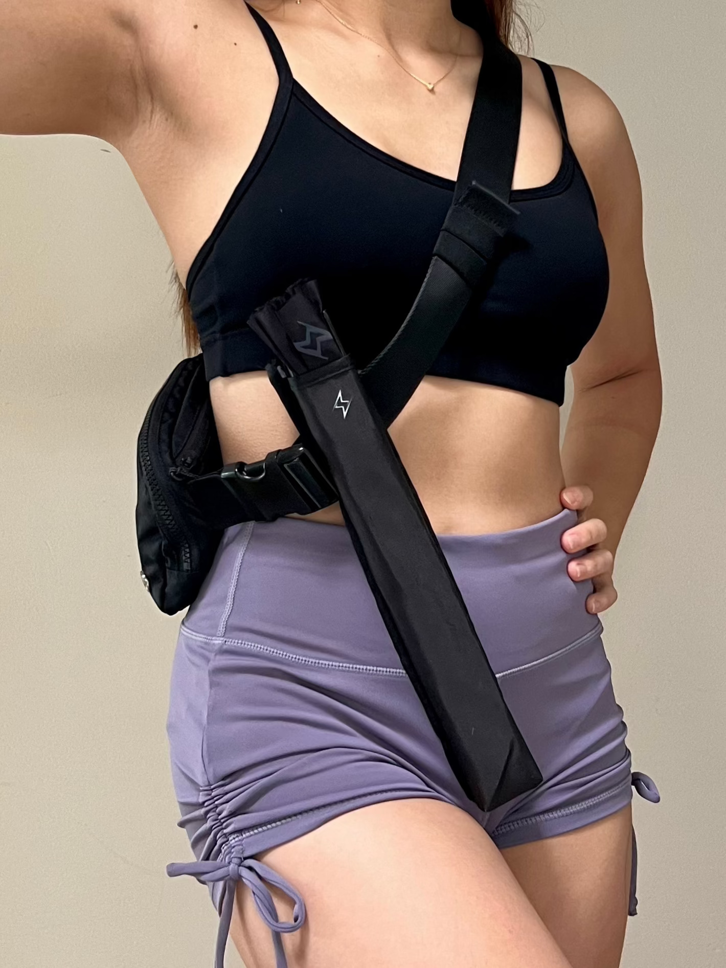 Fan holster attached to bag strap for hands-free convenience