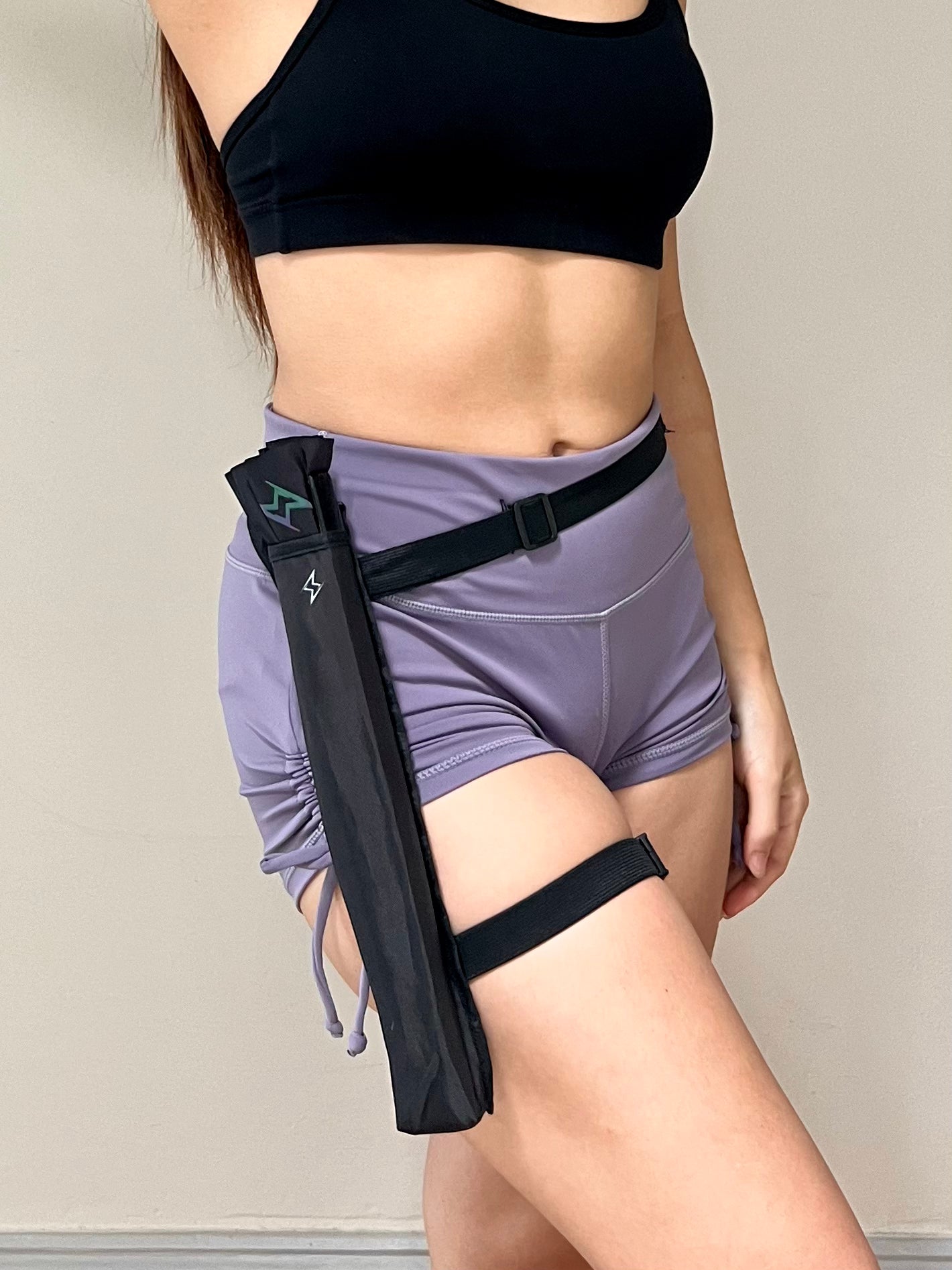 Electric Eden fan holster showcasing leg wrap and bag strap attachment